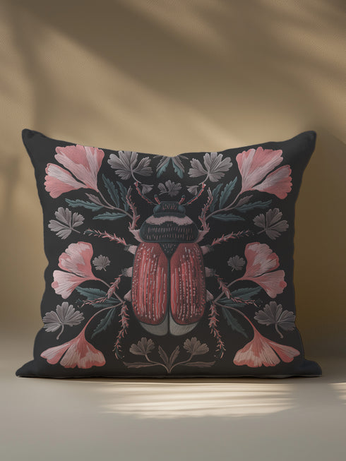 Elegant black pillowcase featuring detailed coral-red beetle illustration centered amid symmetrical pink flowers and gray-green foliage. The dark background enhances the intricate entomology artwork with fine detailing throughout the botanical and insect elements.
